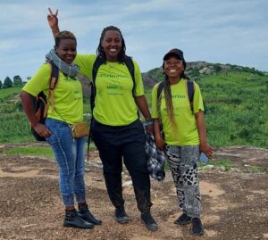 2023-24 Pathy Fellow, Danie Mahirane, poses with SASA-RDC team members in Uganda.